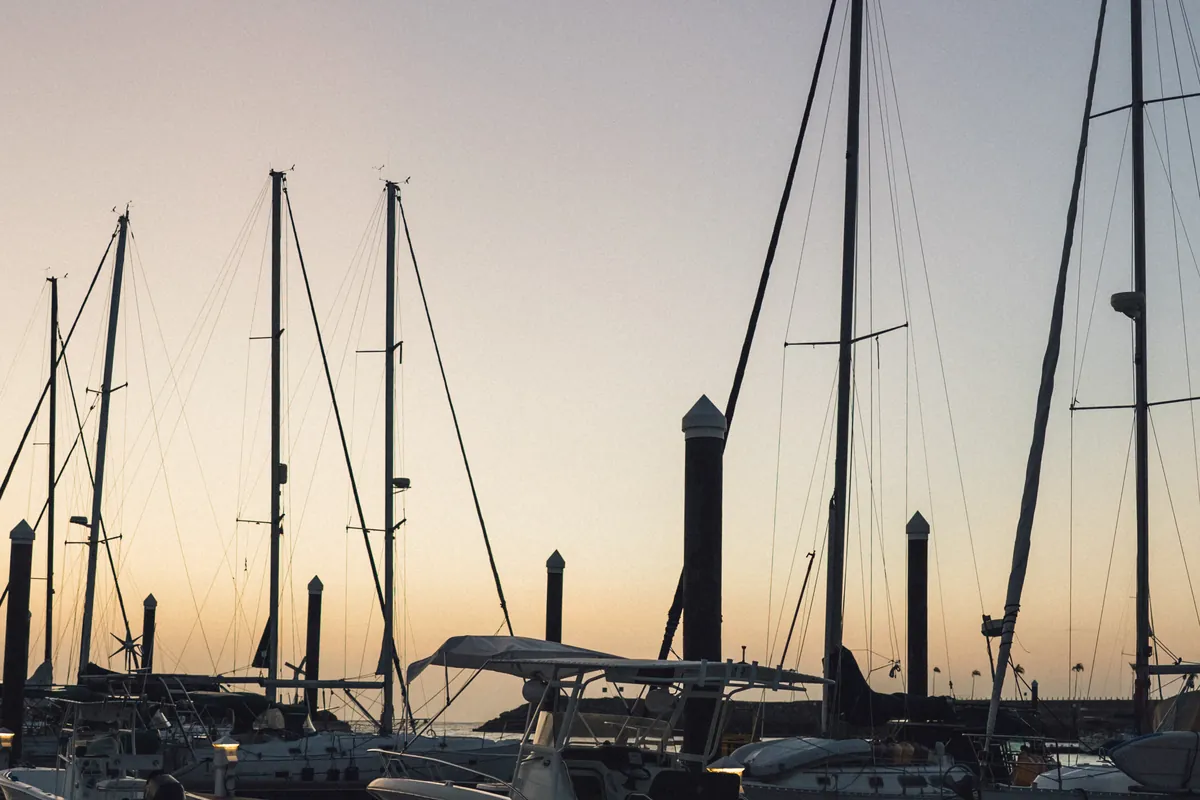 Oasis moored at the Vista Mar Marina dock at twilight
