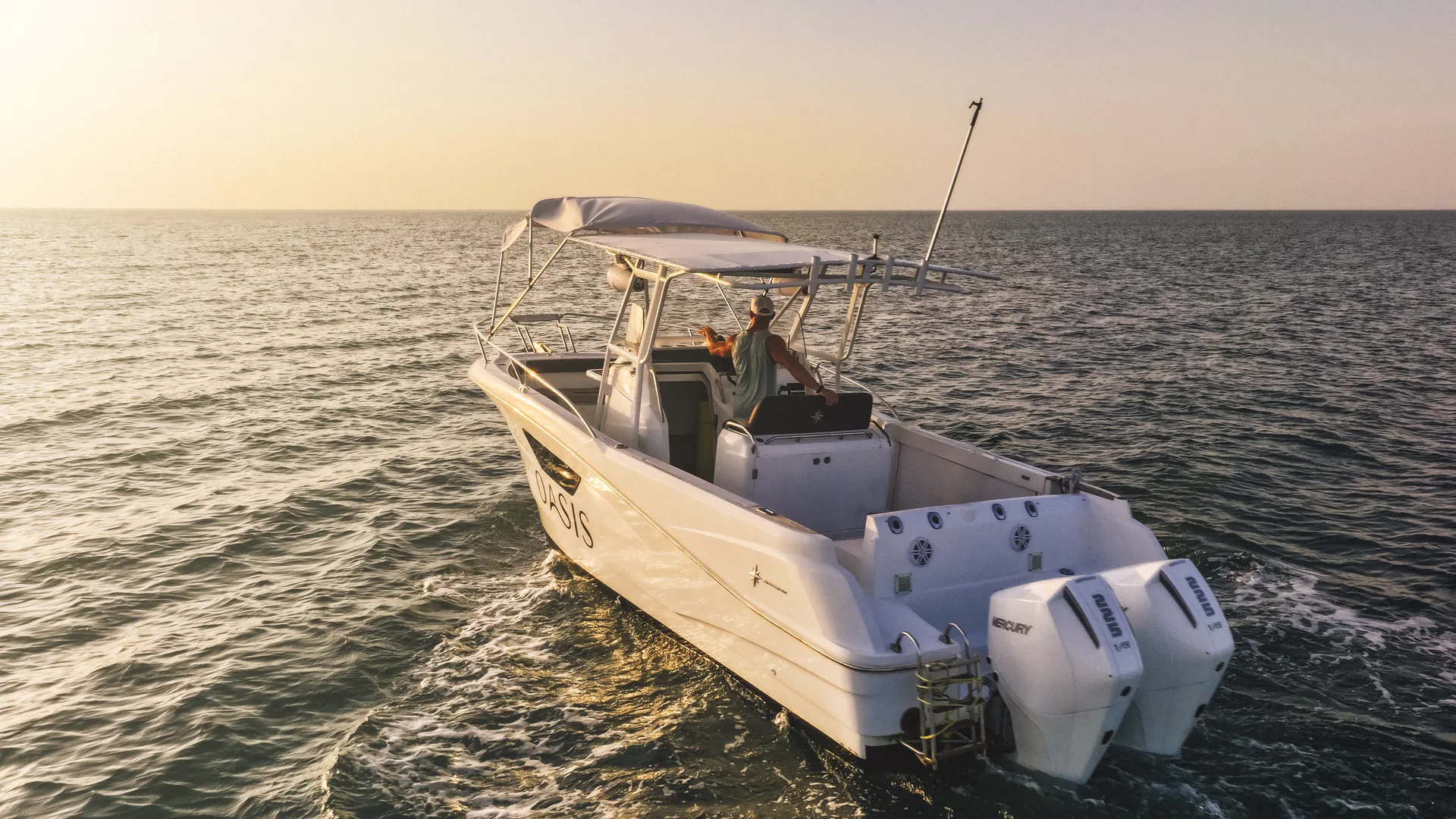 Oasis, Jeanneau Cap Camarat 9.0 CC with twin white Mercury 225 outboards, cruising into a golden Pacific sunset off Vista Mar