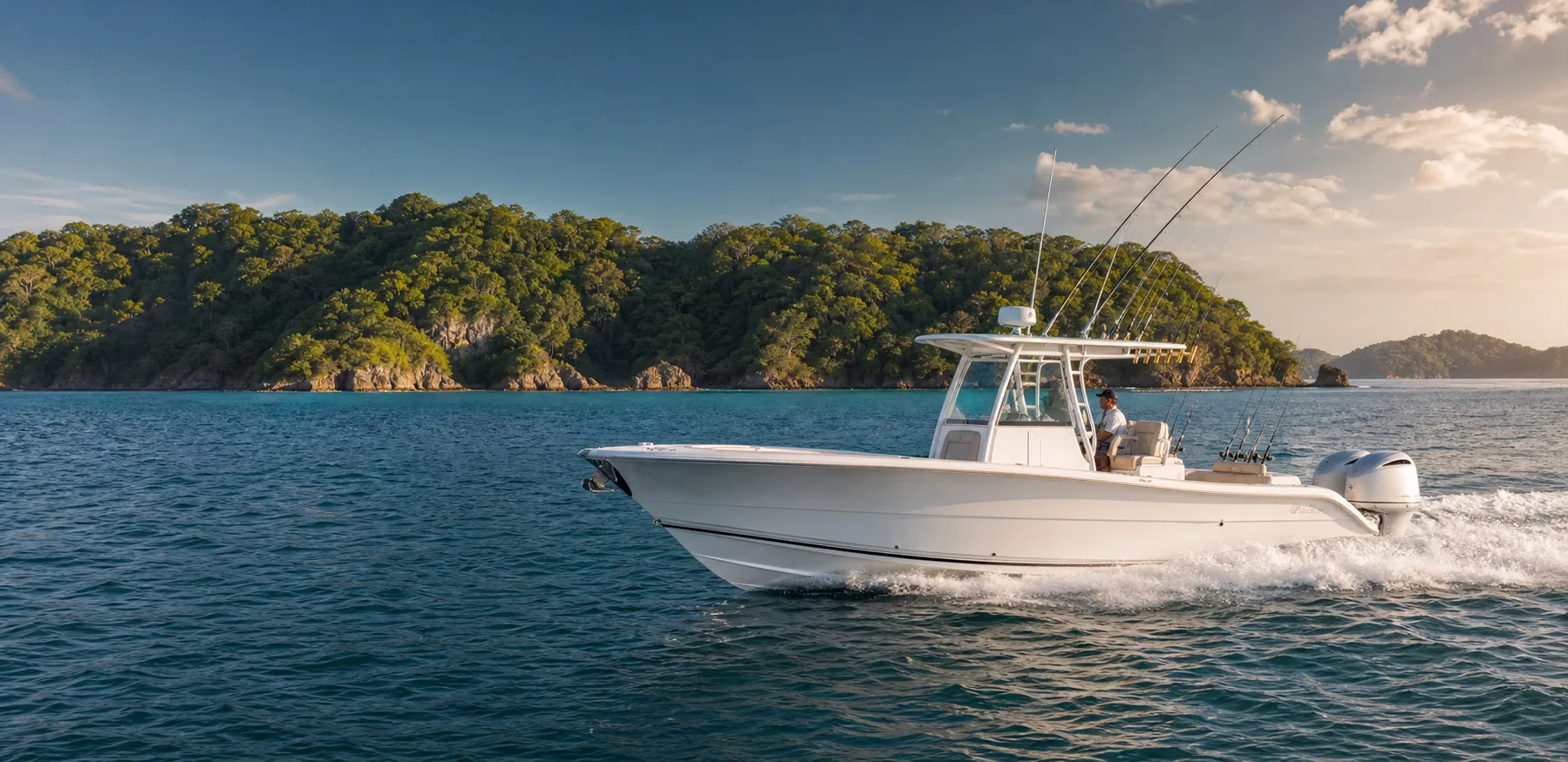 Private center-console sportfishing boat cruising along a tropical Panama coastline